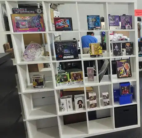Shelf of action figures and collectibles at a Berthoud, Colorado comic shop